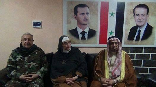 Mother Agnes Mariam (centre) pictures with Mihrac Ural (left), a Turkish Alawite who led the NDF forces that slaughtered the Sunni inhabitants of Bayda and Baniyas in the Tartus Province on the coast (October 2013)