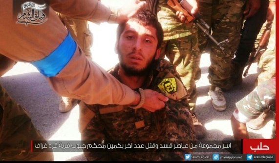 PYD fighter captured by Faylaq al-Sham, 28 AUG 2016. Patch is a picture of PKK's Abdullah Ocalan (